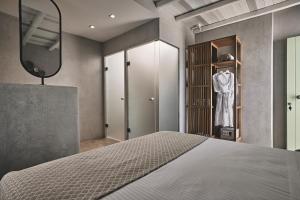 A bed or beds in a room at Noon Beyond Accommodation