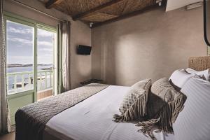 A bed or beds in a room at Noon Beyond Accommodation