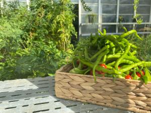 a basket full of green vegetables sitting on a table at Crowne Plaza Istanbul Oryapark by IHG in Istanbul