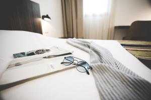 Postel nebo postele na pokoji v ubytování Nof Tavor Hotel