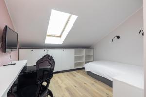 Televízia a/alebo spoločenská miestnosť v ubytovaní ĄĘ Hostel Nowy Świat
