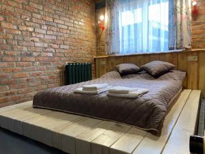 Posteľ alebo postele v izbe v ubytovaní BrickWood
