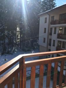 a view from the balcony of a building with snow on the ground at Studios -Villa Park SV in Borovets