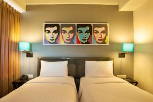 Voodi või voodid majutusasutuse idoop Hotel Lombok toas