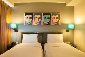 Idoop Hotel by Prasanthi客房内的一张或多张床位