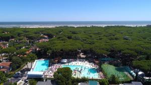 an overhead view of a pool with a tennis court at Mipro mobilhome 6 in Lido di Spina