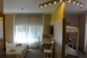 Postel nebo postele na pokoji v ubytování Alba Hotel
