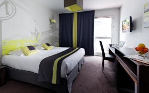 En eller flere senger på et rom på Lagrange Apart’Hotel Paris-Boulogne