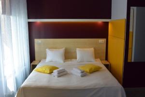 Postel nebo postele na pokoji v ubytování Alba Hotel