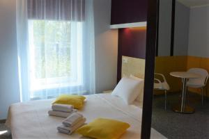 Postel nebo postele na pokoji v ubytování Alba Hotel