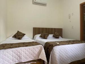 Ένα ή περισσότερα κρεβάτια σε δωμάτιο στο Pousada da Villa