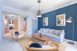 a living room with a couch and a table at St Jakov Superior Beach Apartment with Free Parking in Dubrovnik