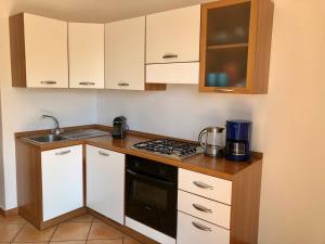 Kuchyň nebo kuchyňský kout v ubytování Residenza Ai Ronchi 3 4 7 8