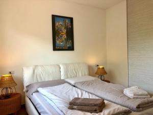 Postel nebo postele na pokoji v ubytování Residenza Ai Ronchi 3 4 7 8