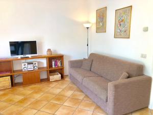 TV a/nebo společenská místnost v ubytování Residenza Ai Ronchi 3 4 7 8