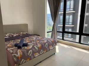 Postel nebo postele na pokoji v ubytování Resort Suite @Midhill Genting
