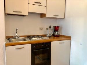 Kuchyň nebo kuchyňský kout v ubytování Residenza Ai Ronchi 3 4 7 8