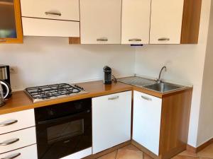 Kuchyň nebo kuchyňský kout v ubytování Residenza Ai Ronchi 3 4 7 8
