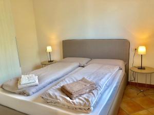 Postel nebo postele na pokoji v ubytování Residenza Ai Ronchi 3 4 7 8