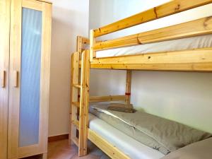 Postel nebo postele na pokoji v ubytování Residenza Ai Ronchi 3 4 7 8