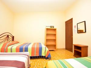 Postel nebo postele na pokoji v ubytování Los Nardos Hostel -pet friendly-