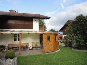 a tiny house in the backyard of a house at Haus Fiedler in Piding