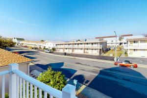 a view of a street with a car in a parking lot at Captain's Deck in Ocean City