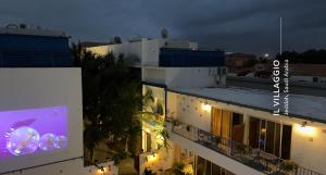 a view of a building at night at Il Villaggio Luxury Villas in Jeddah