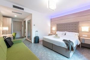Postel nebo postele na pokoji v ubytování HOTEL TRILAGO