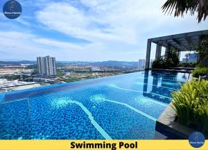 a swimming pool on the roof of a building at Revo Home at Pavilion Bukit Jalil in Kuala Lumpur