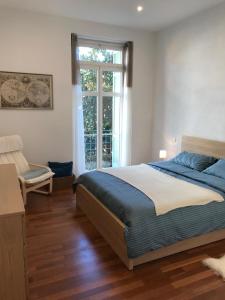 Ένα ή περισσότερα κρεβάτια σε δωμάτιο στο Menton vue jardins Biovès spacieux 2 pièces 52m2 en hypercentre