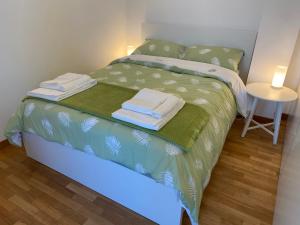 Postel nebo postele na pokoji v ubytování Green House Ancona