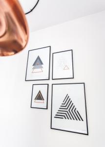 a drawing of geometric drawings on a wall at Check in Szczecin in Szczecin