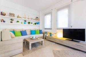a living room with a large flat screen tv at Ekavi Villa in Skala Potamias