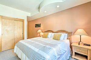 a bedroom with a large white bed and a night stand at Solitude Creekside Condo-Closest to Ski Lift! in Solitude +24 photos