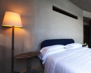 Postel nebo postele na pokoji v ubytování Hotel Locanda del Benaco