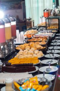 a buffet table filled with lots of food at Golden Park Salvador in Salvador