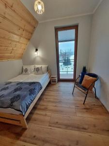 Katil atau katil-katil dalam bilik di Apartamenty Słodyczki