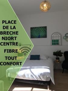 a bedroom with a bed with a sign on it at Le Bahia centre la Brèche wifi linge de pressing in Niort