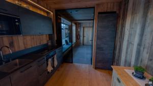 A kitchen or kitchenette at Rufana Alpsuite
