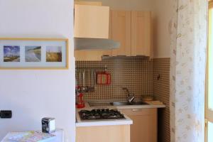 A kitchen or kitchenette at Lacona Mare - HelloElba