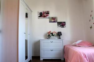 A bed or beds in a room at Lacona Mare - HelloElba