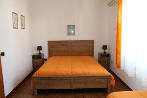 Postel nebo postele na pokoji v ubytování Lacona Mare - HelloElba