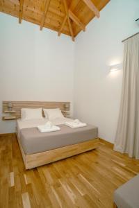 Ein Bett oder Betten in einem Zimmer der Unterkunft Fragios Beach House