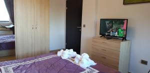 A bed or beds in a room at Lovely Аpartment in IGLIKA 2,Borovets