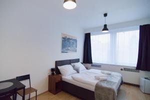 Ένα ή περισσότερα κρεβάτια σε δωμάτιο στο Hotel U Ševce