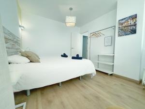 Posteľ alebo postele v izbe v ubytovaní Apartamento Soho Malaga