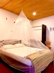 Postel nebo postele na pokoji v ubytování Hotel Minca - La Casona