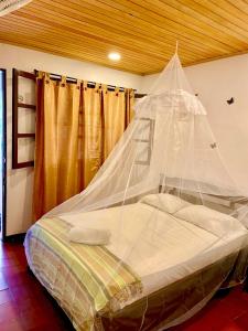 Postel nebo postele na pokoji v ubytování Hotel Minca - La Casona
