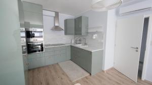 A kitchen or kitchenette at Air-conditioned, 2 room apartment with terrace